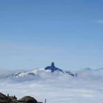 the black tusk on top of a snow covered mountain