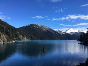 Garibaldi Lake in Whistler with snow-capped mountains as the backdrop
