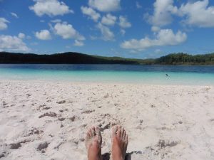 The crystal clear waters and white sandy shoreline of Lake Mackenzie on Fraser