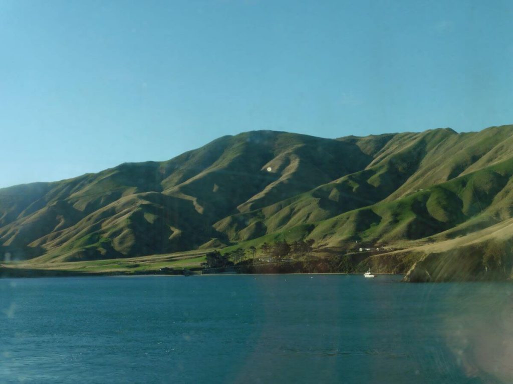 the sea with rolling hills as the backdrop