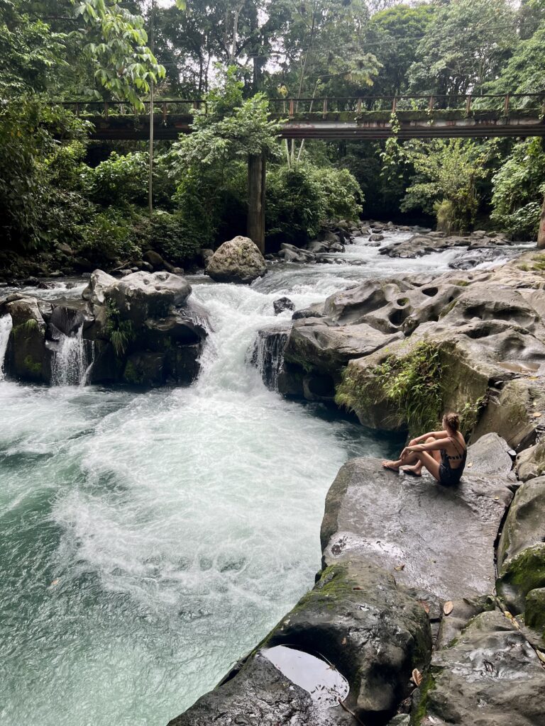 me and a fast flowing river with a small waterfall drop