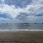 a moody looking view of small fishing boats filling up the bay